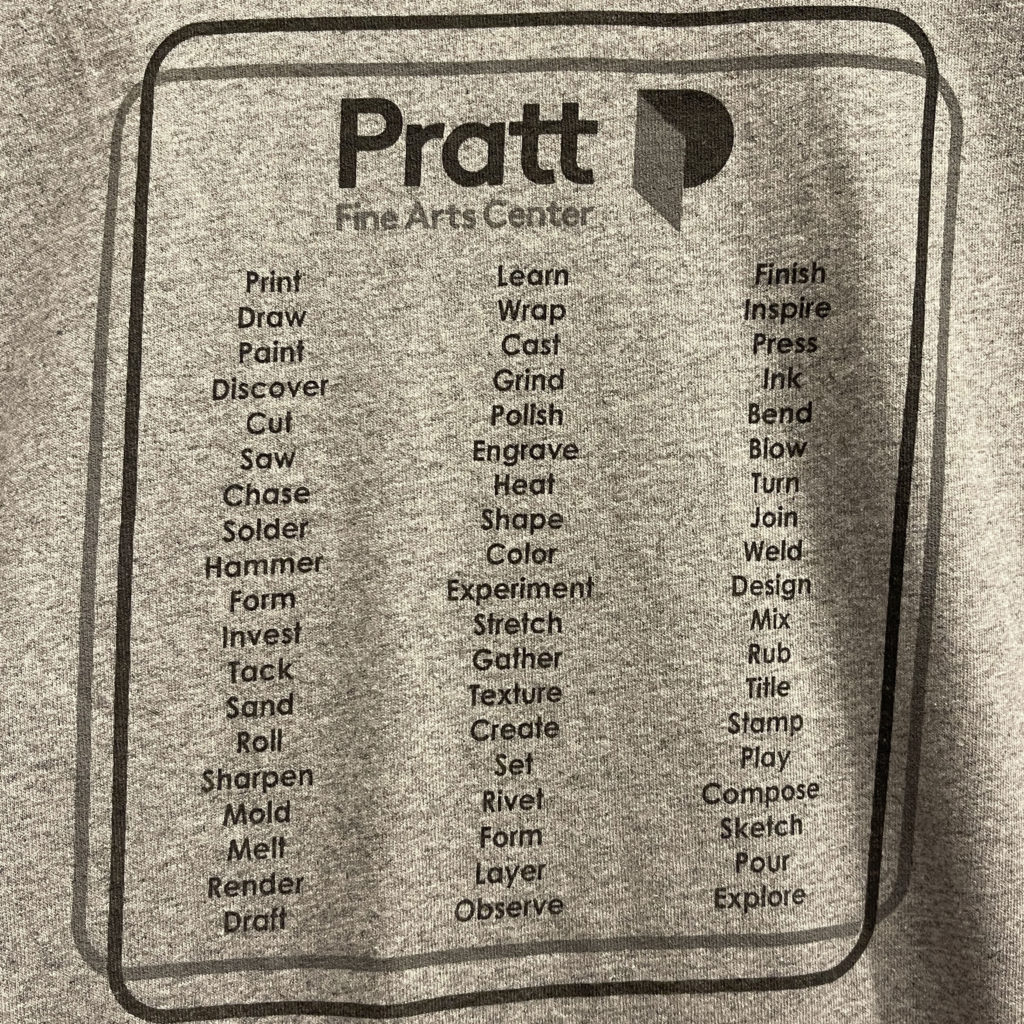 back of t-shirt has lists of verbs for making things